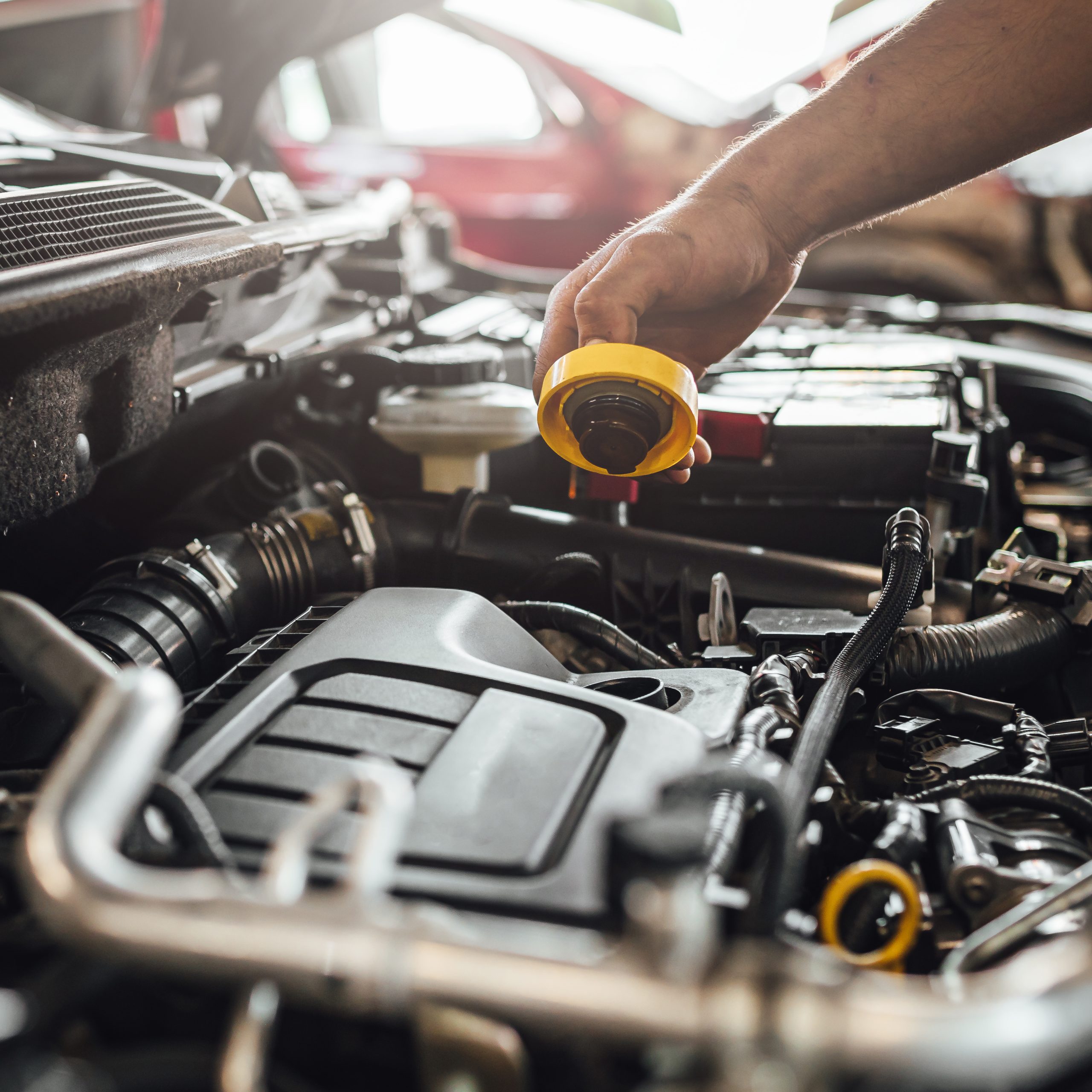 A closeup shot of auto mechanic hands doing car technical inspection in service